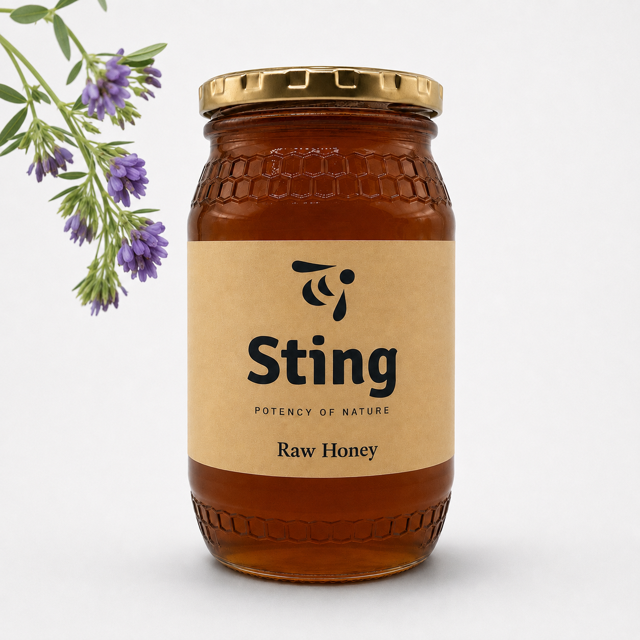 Jar of Sting Raw Honey with a lavender sprig on the left, beige label and gold cap visible